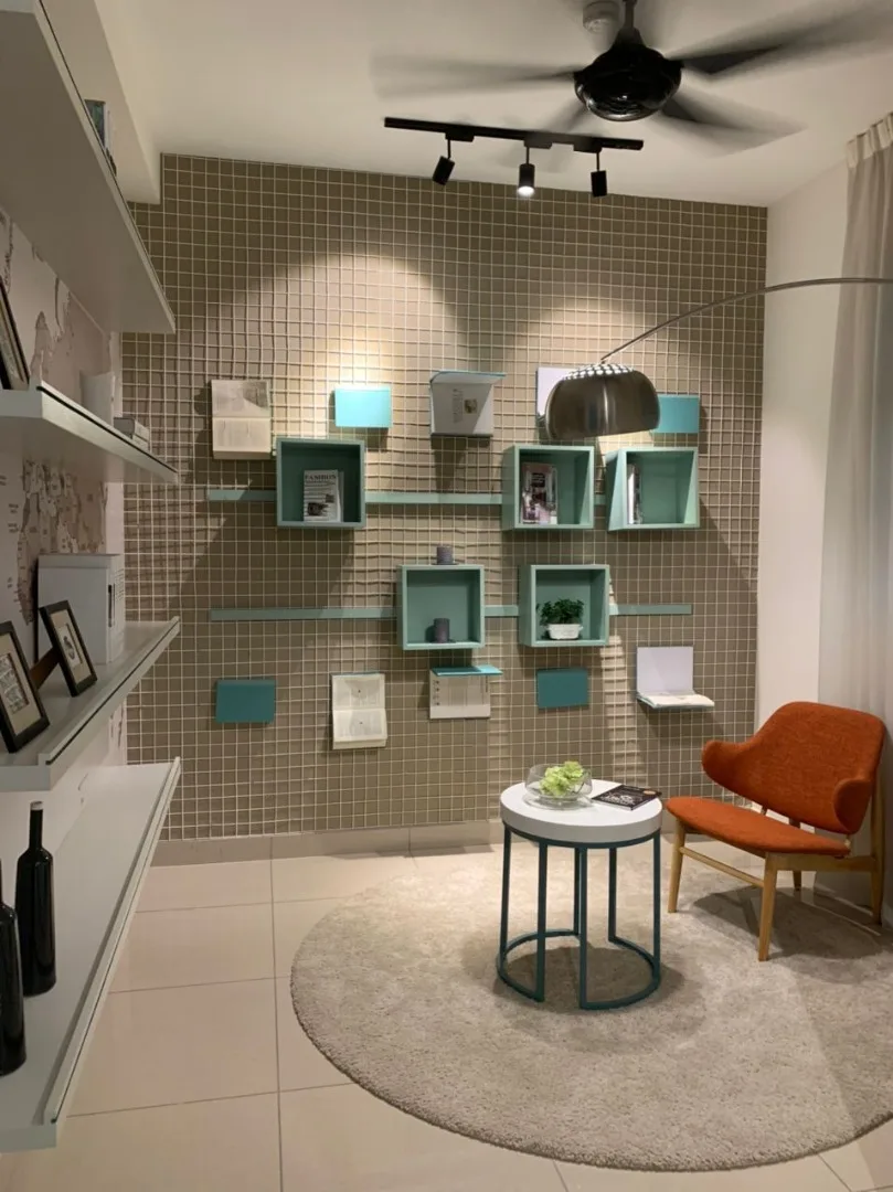 Alpinia Residence Interior design of a living room with shelves, a small table, and a chair. in Nilai, Freehold property development, photo