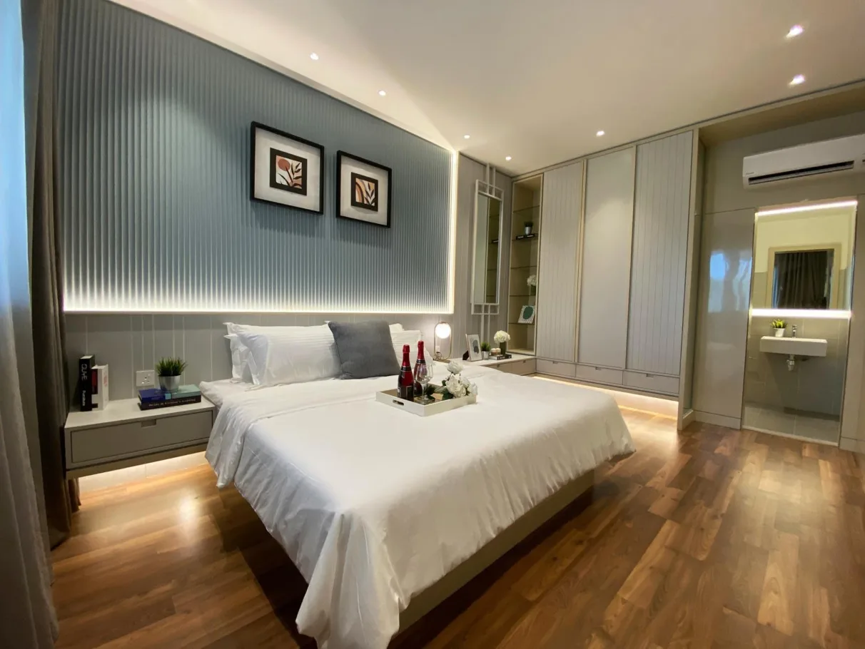 Aster Hill This image showcases a bedroom interior with a bed, side tables, artwork, wardrobe, and a view into the bathroom. in Kuala Lumpur, Freehold property development, photo