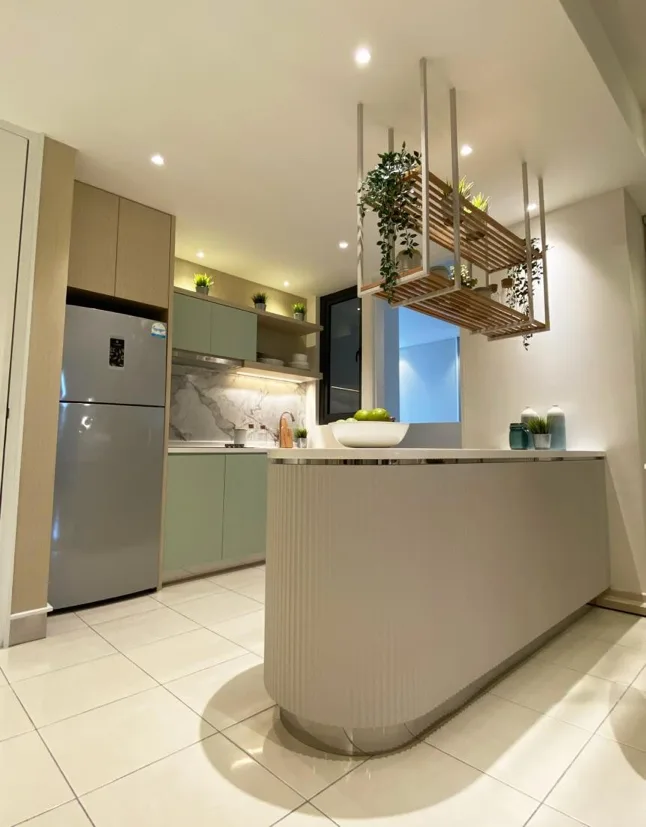 Aster Hill Image shows the kitchen interior with a refrigerator, kitchen counter, cabinets, and hanging plant rack. in Kuala Lumpur, Freehold property development, photo