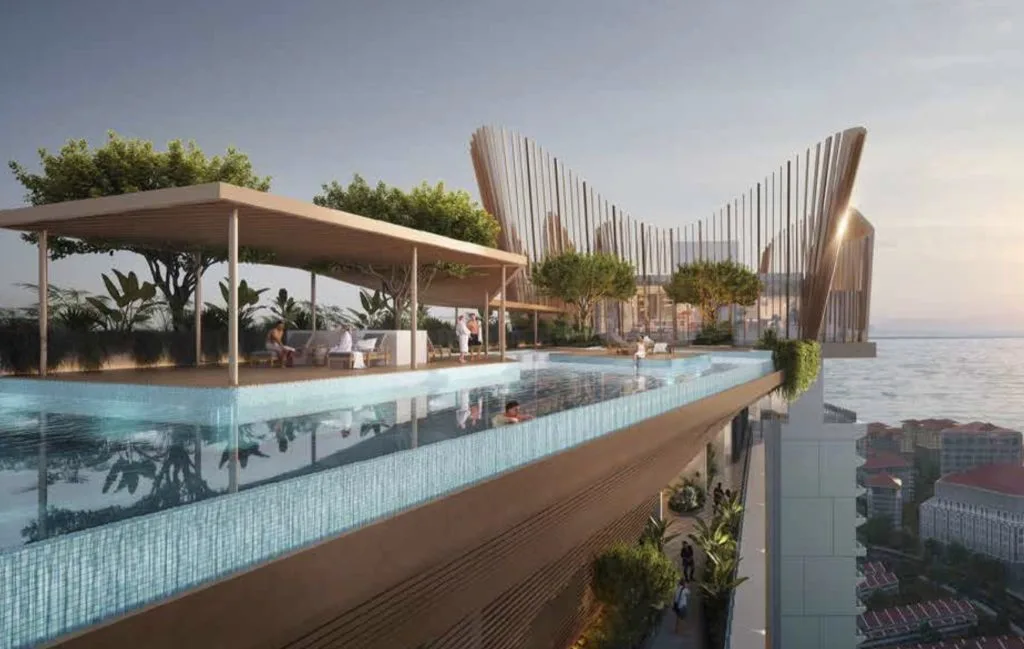 Crown Penang The image shows a rooftop infinity pool with a seating area and a view of the sea. in Pulau Pinang, Freehold property development, render