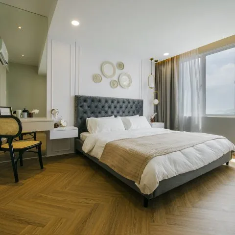 Emerald Residence A bedroom with a bed, desk, and window. in Teluk Kumbar, Freehold property development, photo