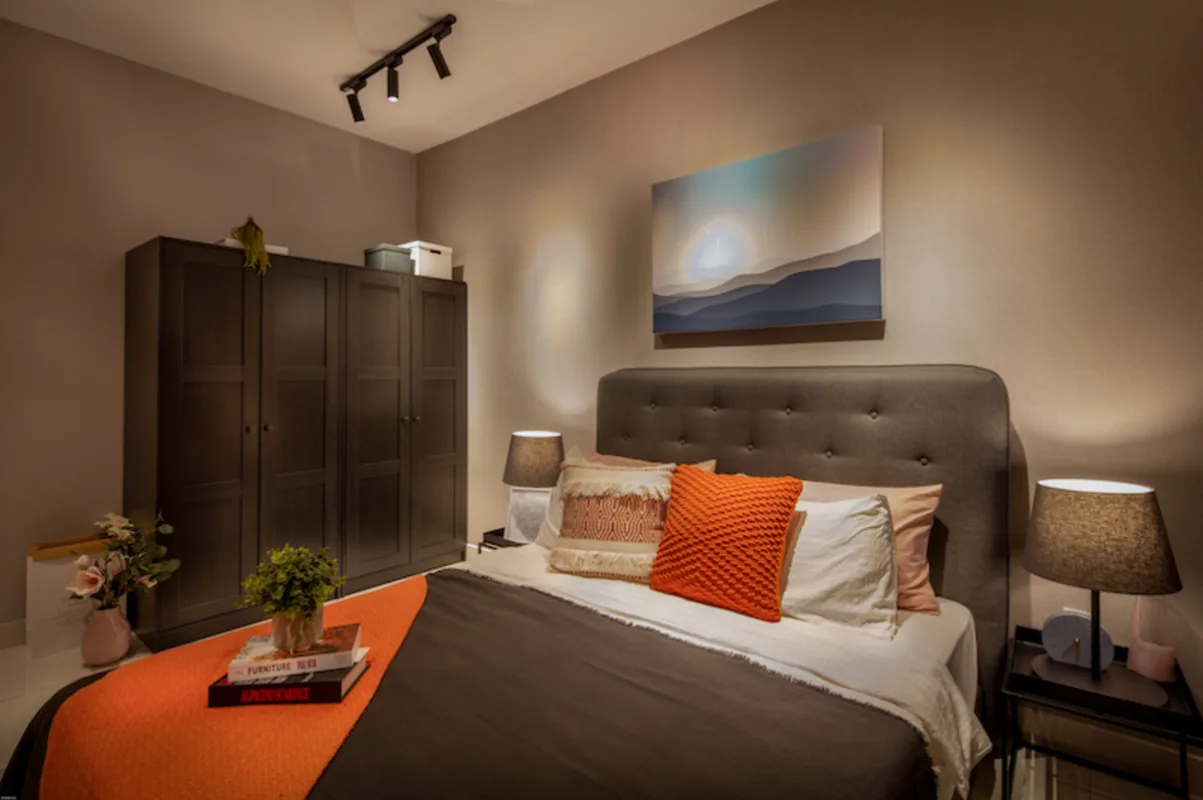 Gamuda Gardens A bedroom with a bed, wardrobe, and bedside table. in Rawang, Leasehold property development, photo