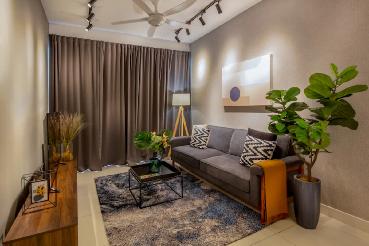 Gamuda Gardens Living room with sofa, coffee table, TV console, and decorations. in Rawang, Leasehold property development, photo