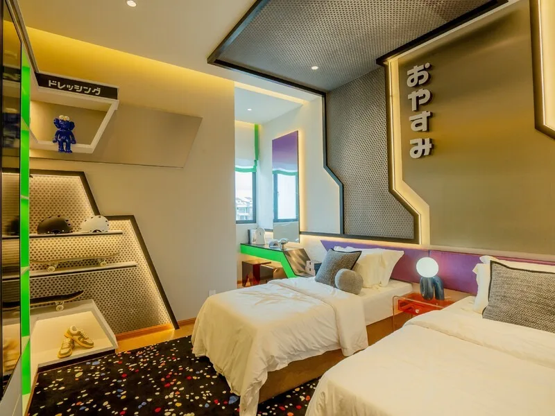 JIA @ Ipoh South Image shows a bedroom with two single beds, a decorative shelf with toys and skateboards, and a desk visible through an open doorway. in Ipoh, Leasehold property development, photo