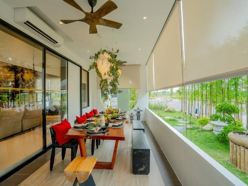 JIA @ Ipoh South Dining area with a long wooden table set for a meal, overlooking a garden with bamboo and stone lanterns. in Ipoh, Leasehold property development, photo