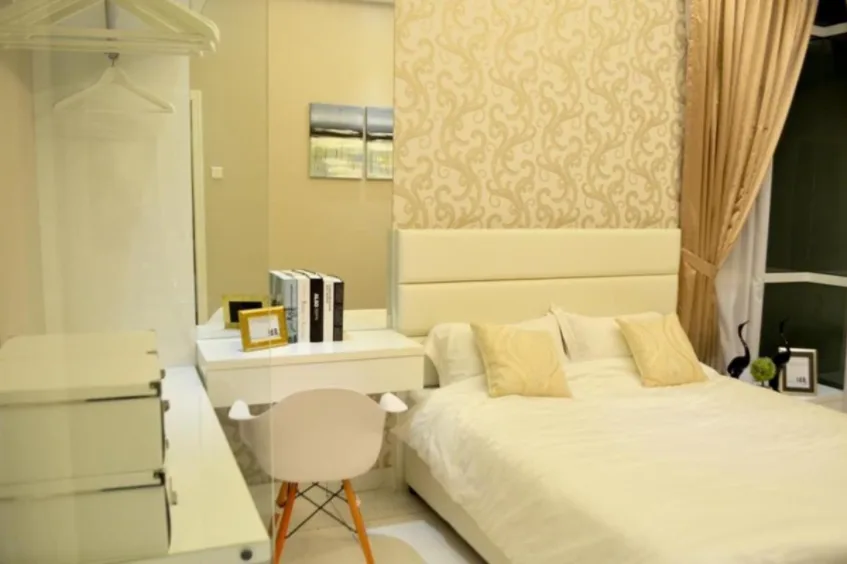 KSL Daya Residences This image shows a bedroom interior with a bed, desk, and wardrobe., Freehold property development, photo