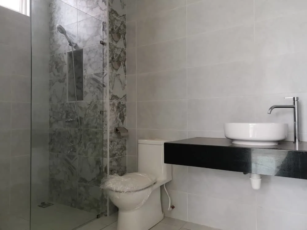 KSL Mutiara Bestari Taman Nusa Bestari Image shows a bathroom interior with a shower, toilet, and sink. in Skudai, Freehold property development, photo