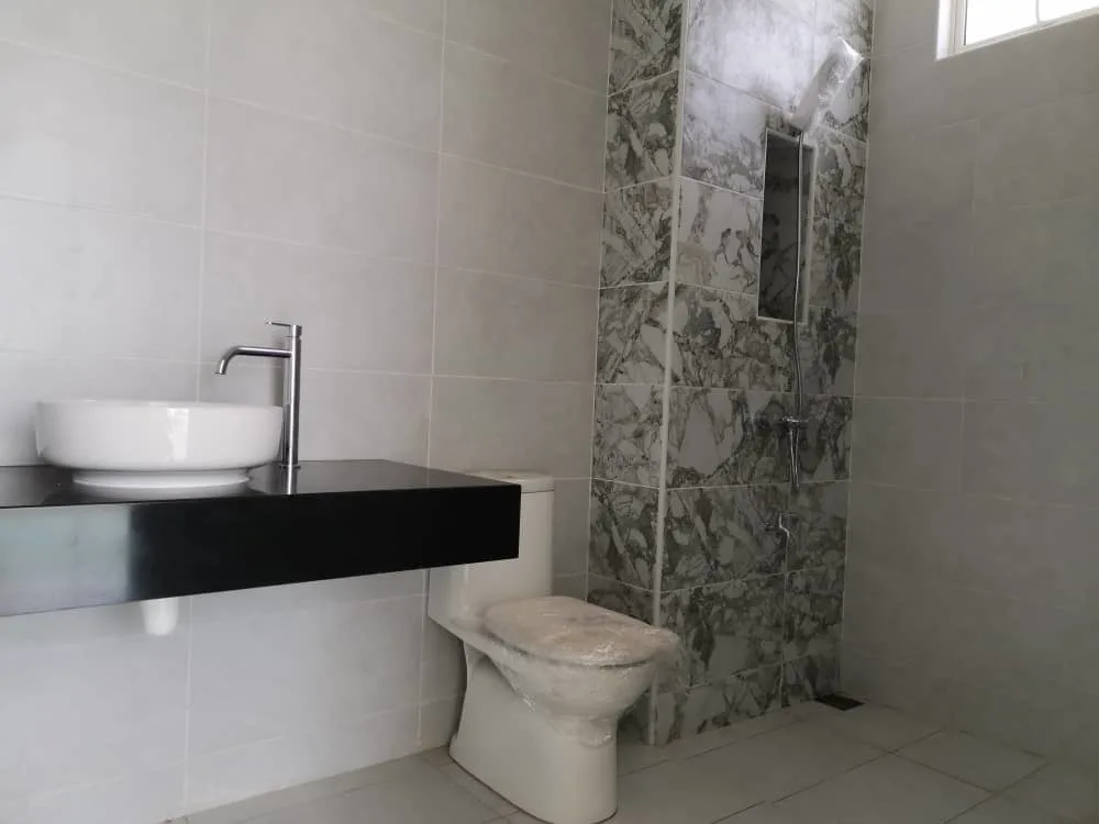 KSL Mutiara Bestari Taman Nusa Bestari The image shows a bathroom interior with a toilet, sink, and shower area. in Skudai, Freehold property development, photo