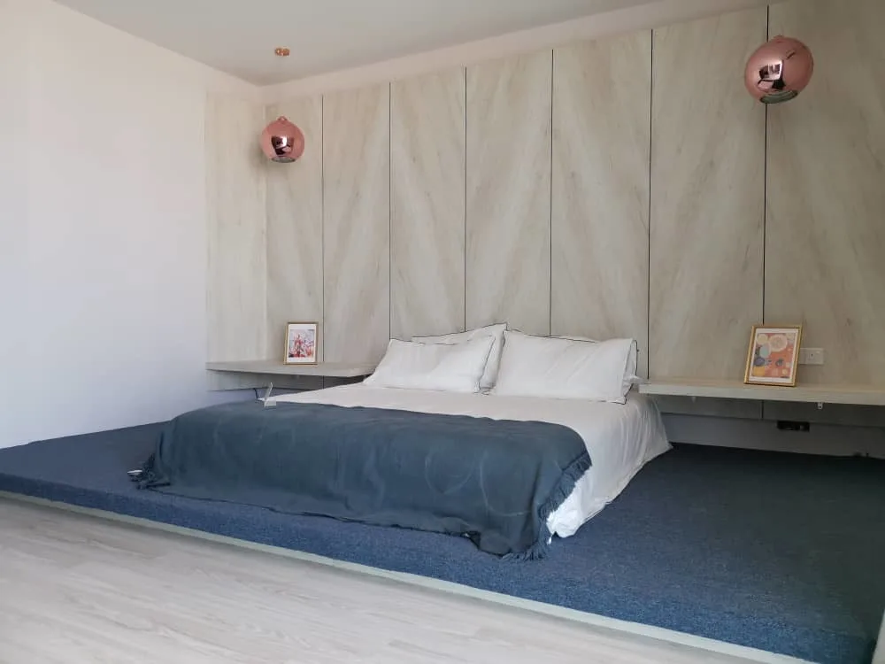 KSL Mutiara Bestari Taman Nusa Bestari Image shows a bedroom with a bed, side table, and chair. in Skudai, Freehold property development, photo
