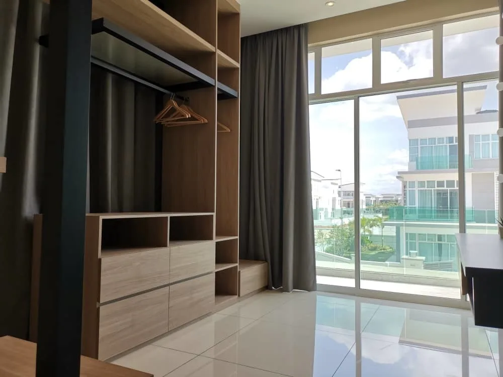KSL Mutiara Bestari Taman Nusa Bestari Image shows a bedroom interior with a built-in wardrobe and a large window overlooking a residential area. in Skudai, Freehold property development, photo