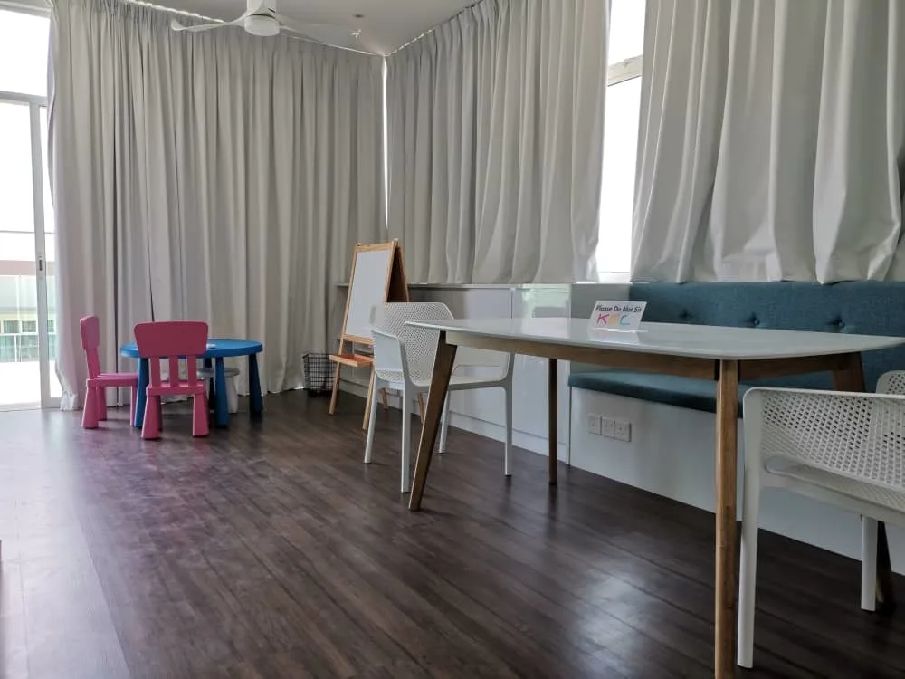 KSL Mutiara Bestari Taman Nusa Bestari Image shows a children's play area with a table, chairs, and a whiteboard. in Skudai, Freehold property development, photo