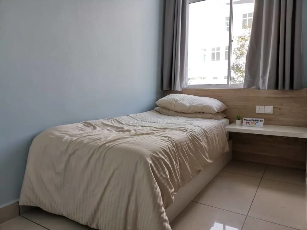 KSL Mutiara Bestari Taman Nusa Bestari Image shows a bedroom with a single bed, window, and side table. in Skudai, Freehold property development, photo