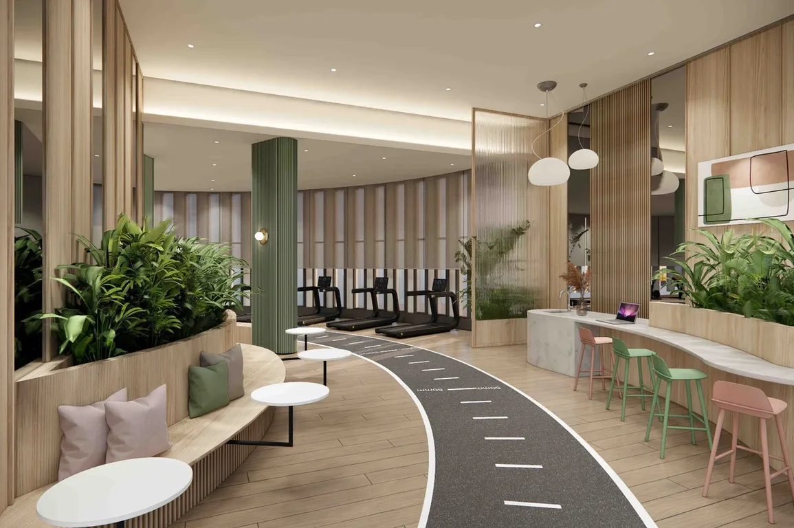 REN Residence The image shows the interior of a gym with treadmills, seating area with plants, and a counter with stools. in Bukit Jalil, Leasehold property development, render